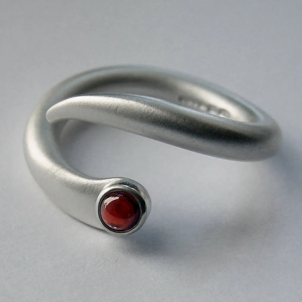 Curving Silver Wiggly Ring with Blue Topaz