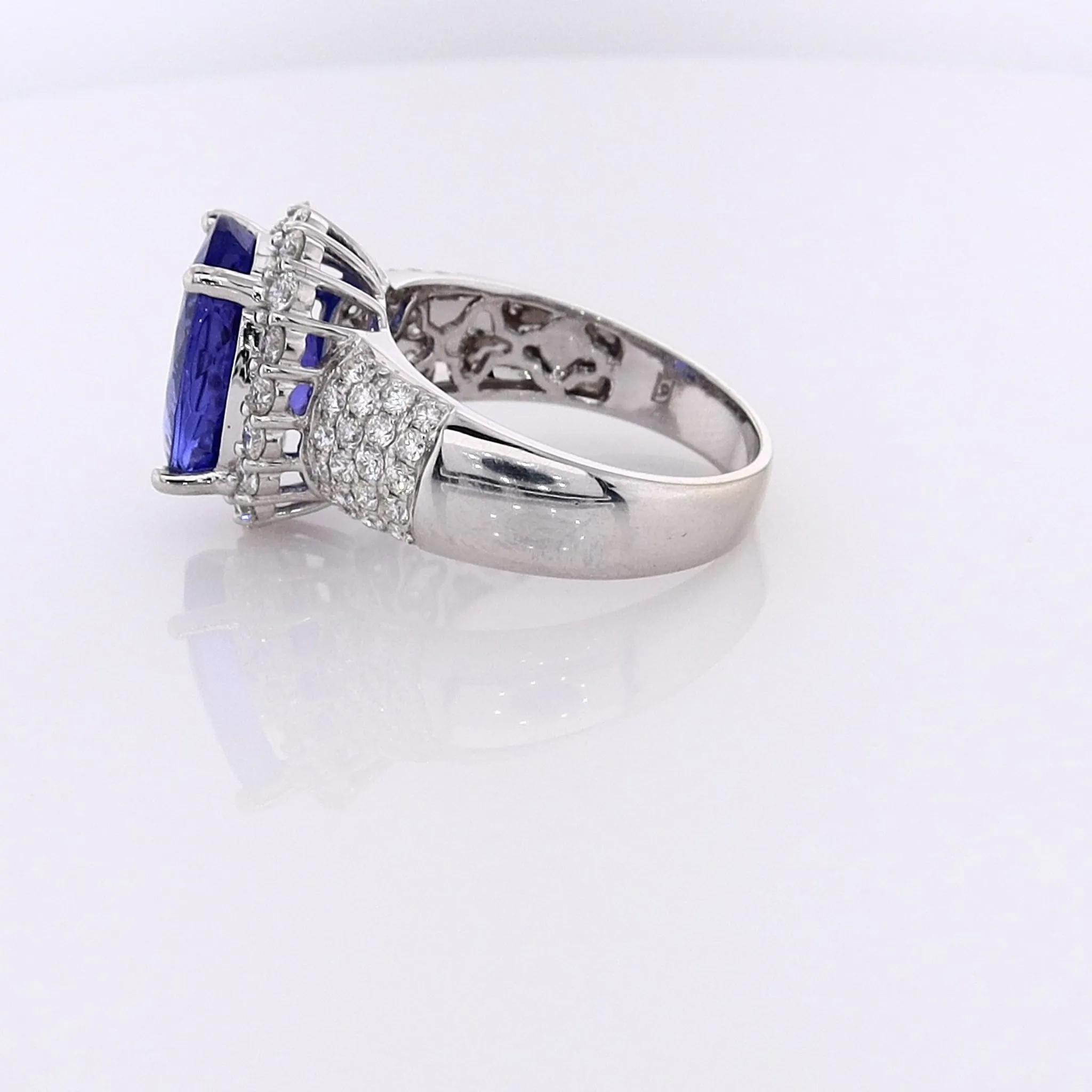 Estate 14 Karat White Gold Tanzanite Ring with Diamond Halo and Shank
